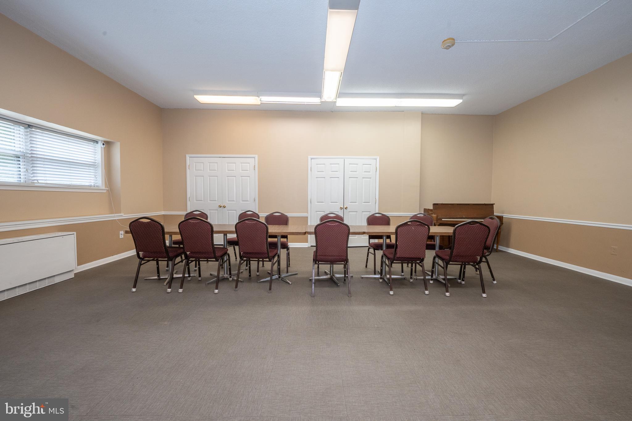 7900 Old York Road, Unit 814A Elkins Park, PA 19027 - Photo 39 of 43 a group of people sitting in a living room