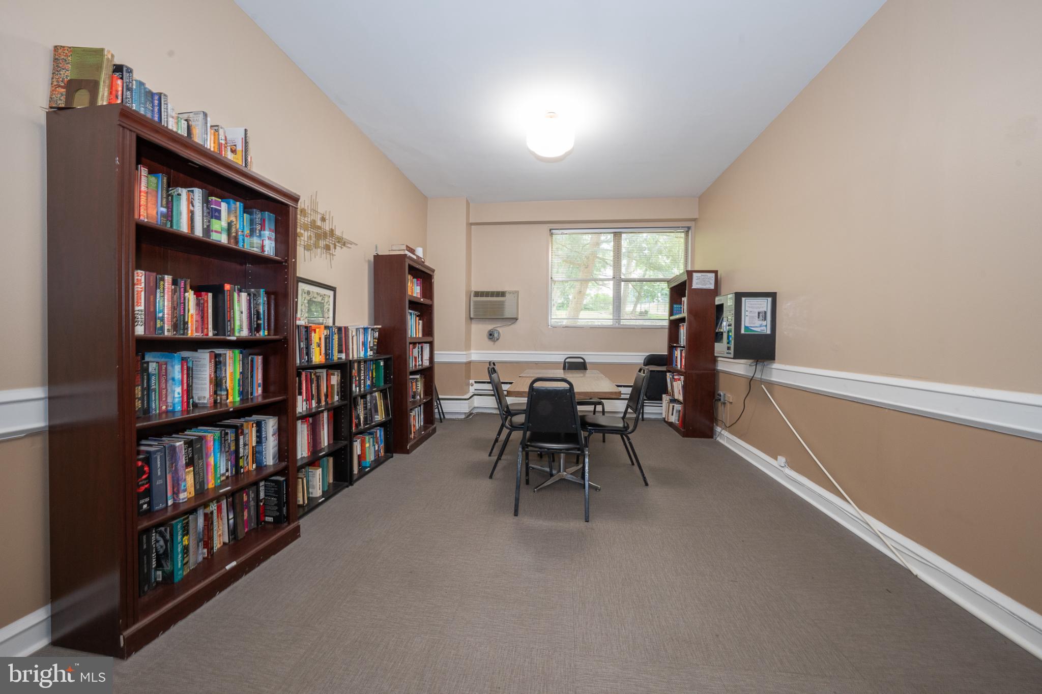 7900 Old York Road, Unit 814A Elkins Park, PA 19027 - Photo 41 of 43 a view of a workspace with furniture and a bookshelf