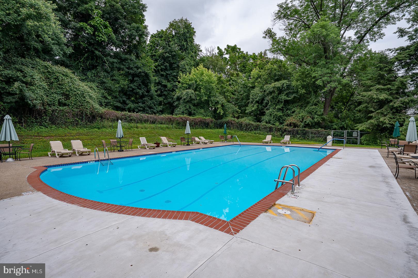 7900 Old York Road, Unit 814A Elkins Park, PA 19027 - Photo 43 of 43 a view of a swimming pool with a yard