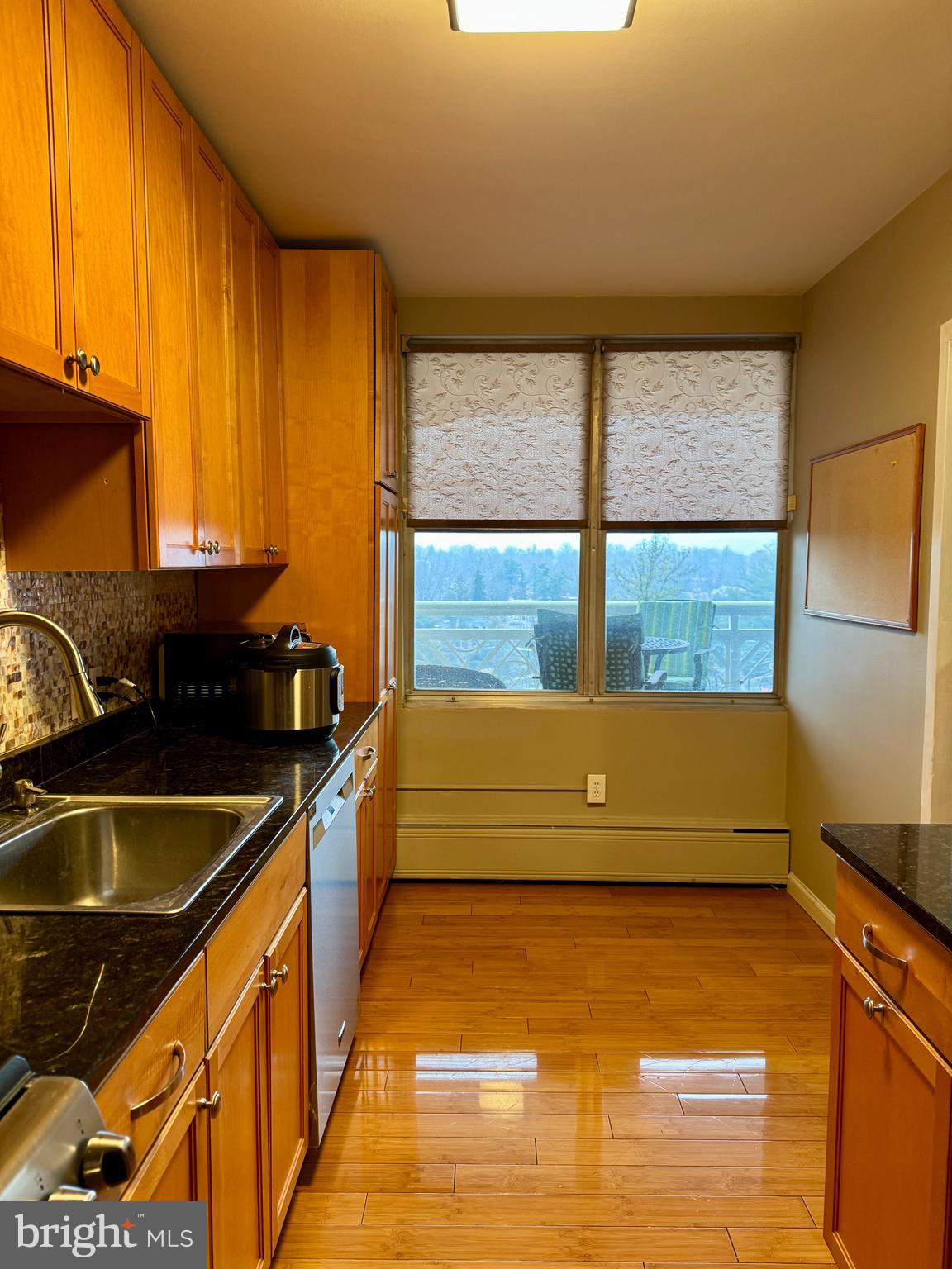 7900 Old York Road, Unit 814A Elkins Park, PA 19027 - Photo 10 of 43 a bathroom with a granite countertop sink and large window