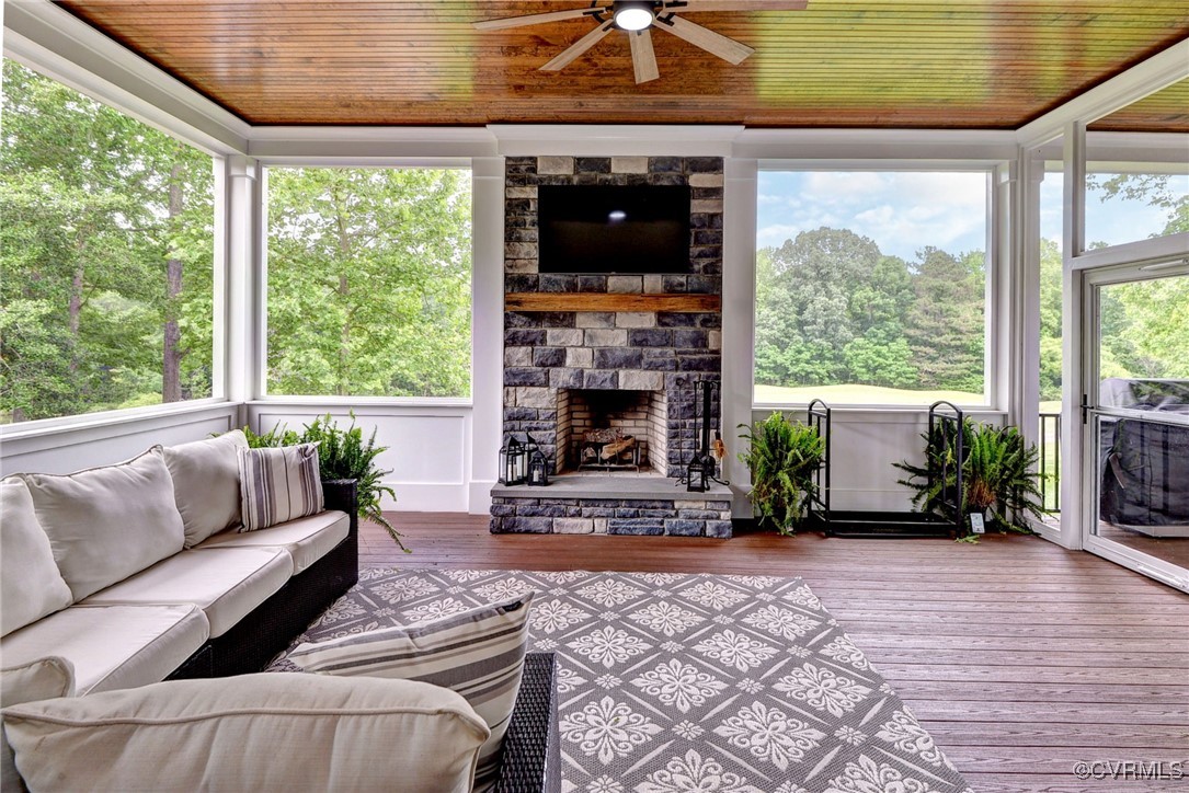 116 Formby Williamsburg, VA 23188 - Photo 13 of 50 a living room with furniture a fireplace and a floor to ceiling window