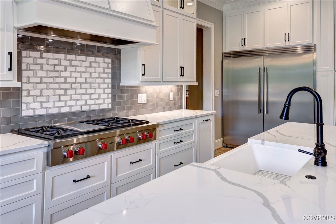 116 Formby Williamsburg, VA 23188 - Photo 17 of 50 a kitchen with stainless steel appliances granite countertop a stove a sink and a refrigerator