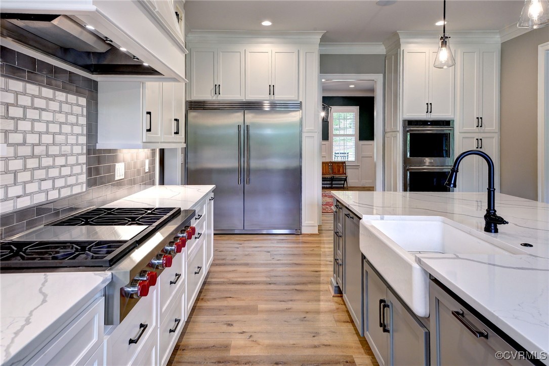 116 Formby Williamsburg, VA 23188 - Photo 18 of 50 a kitchen with stainless steel appliances granite countertop a sink stove and refrigerator