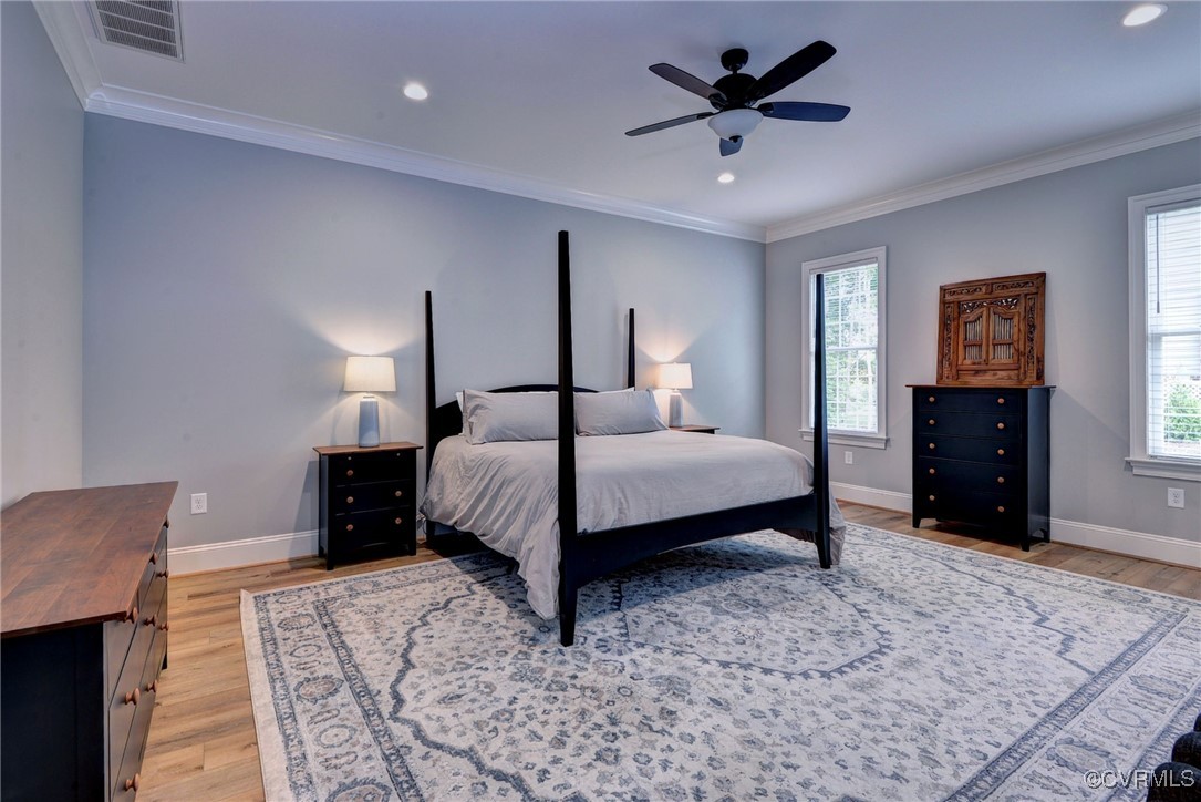 116 Formby Williamsburg, VA 23188 - Photo 24 of 50 a bedroom with a bed and a chandelier