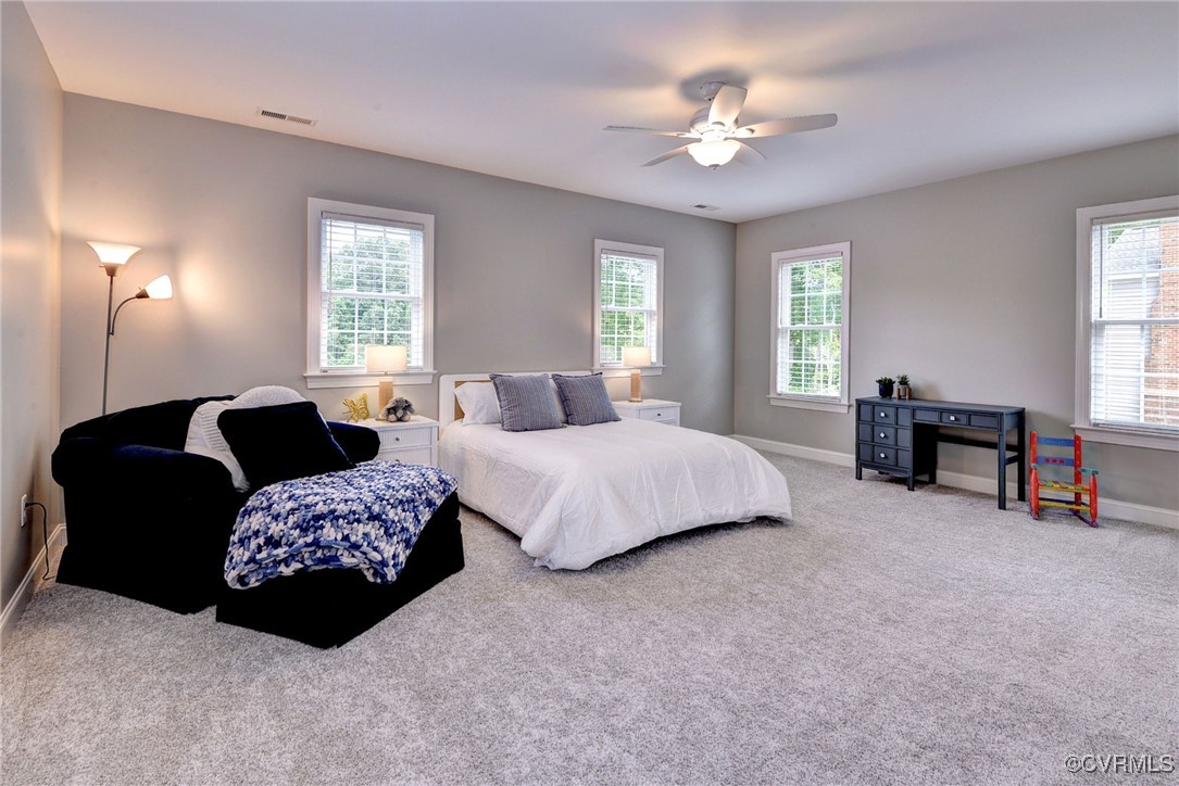 116 Formby Williamsburg, VA 23188 - Photo 35 of 50 a bedroom with bed and a chandelier