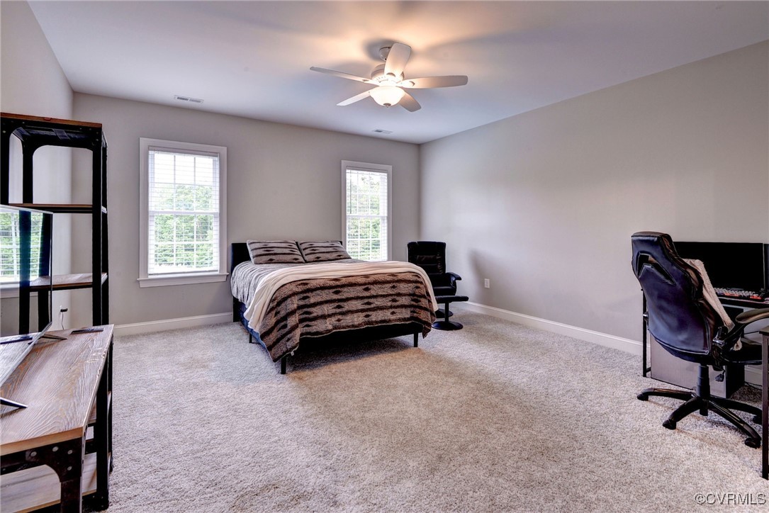 116 Formby Williamsburg, VA 23188 - Photo 38 of 50 a bedroom with a bed a table and a window