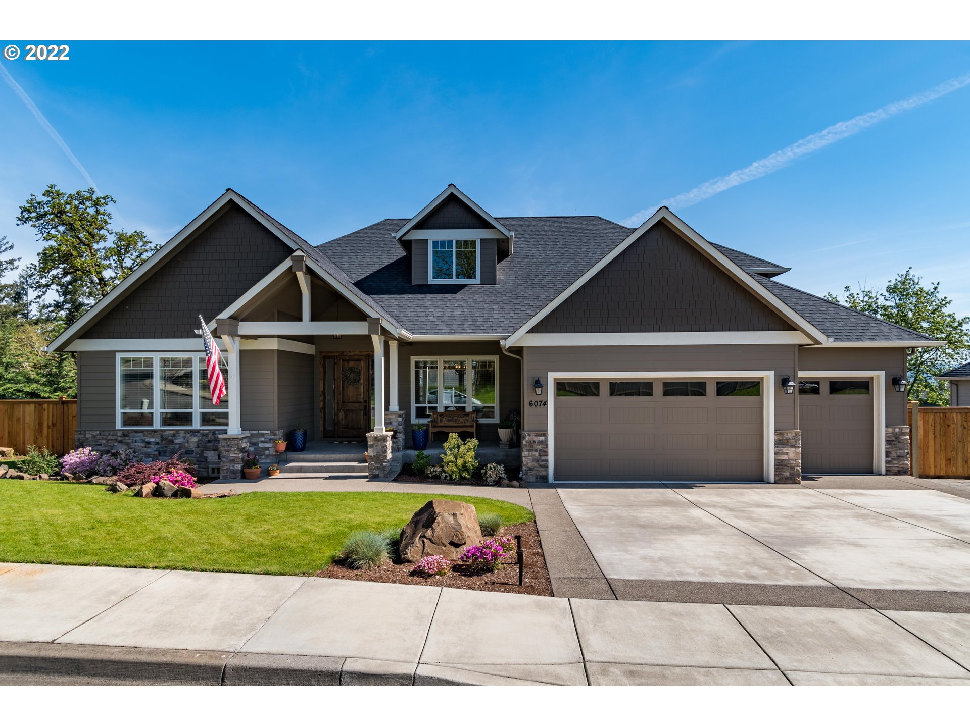 6074 Graystone Loop Springfield, OR 97478 - Photo 1 of 32 a front view of house with yard and garage