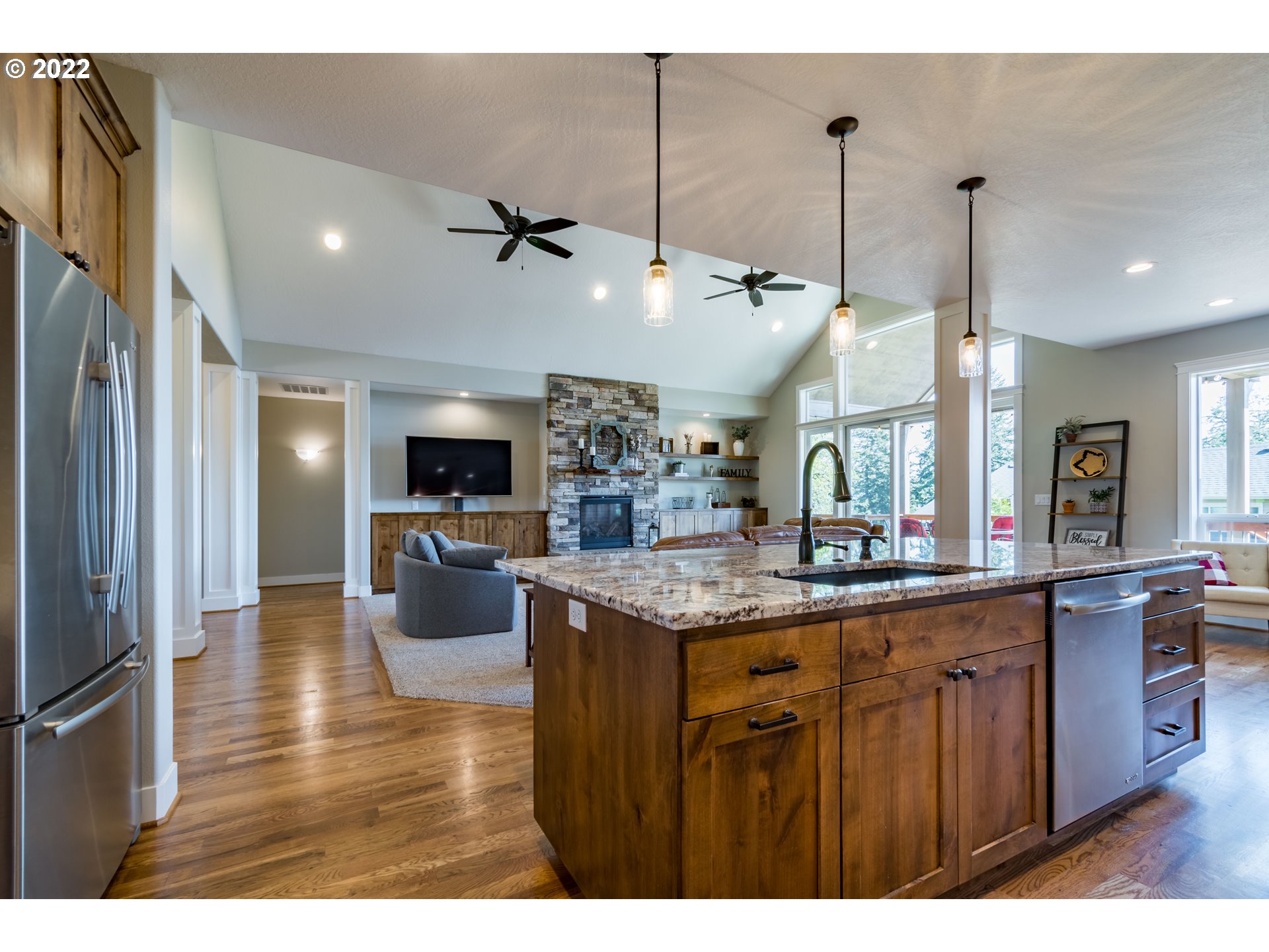 6074 Graystone Loop Springfield, OR 97478 - Photo 13 of 32 a kitchen with a counter top space appliances and a ceiling fan