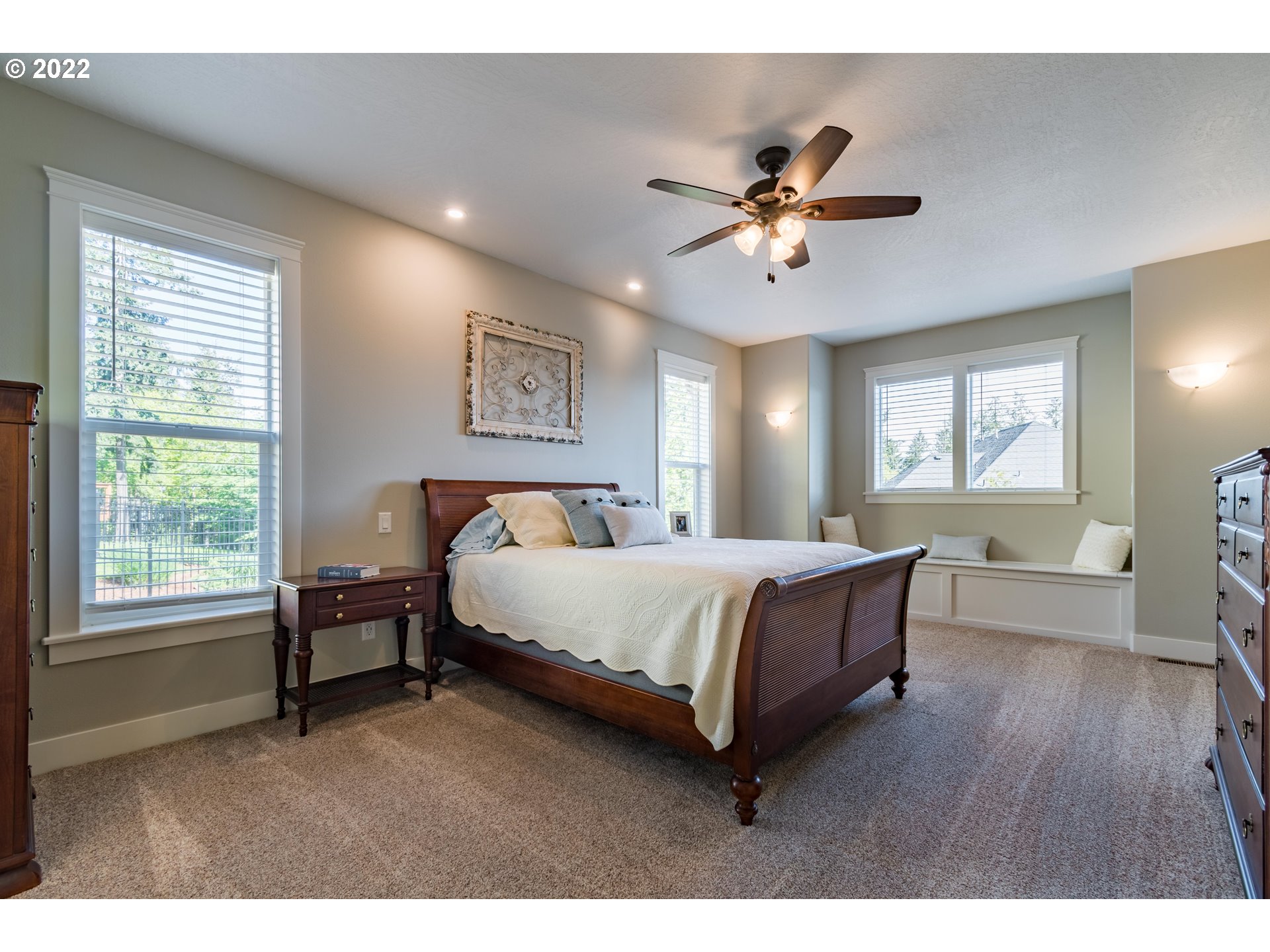 6074 Graystone Loop Springfield, OR 97478 - Photo 15 of 32 a spacious bedroom with a bed and a table in it