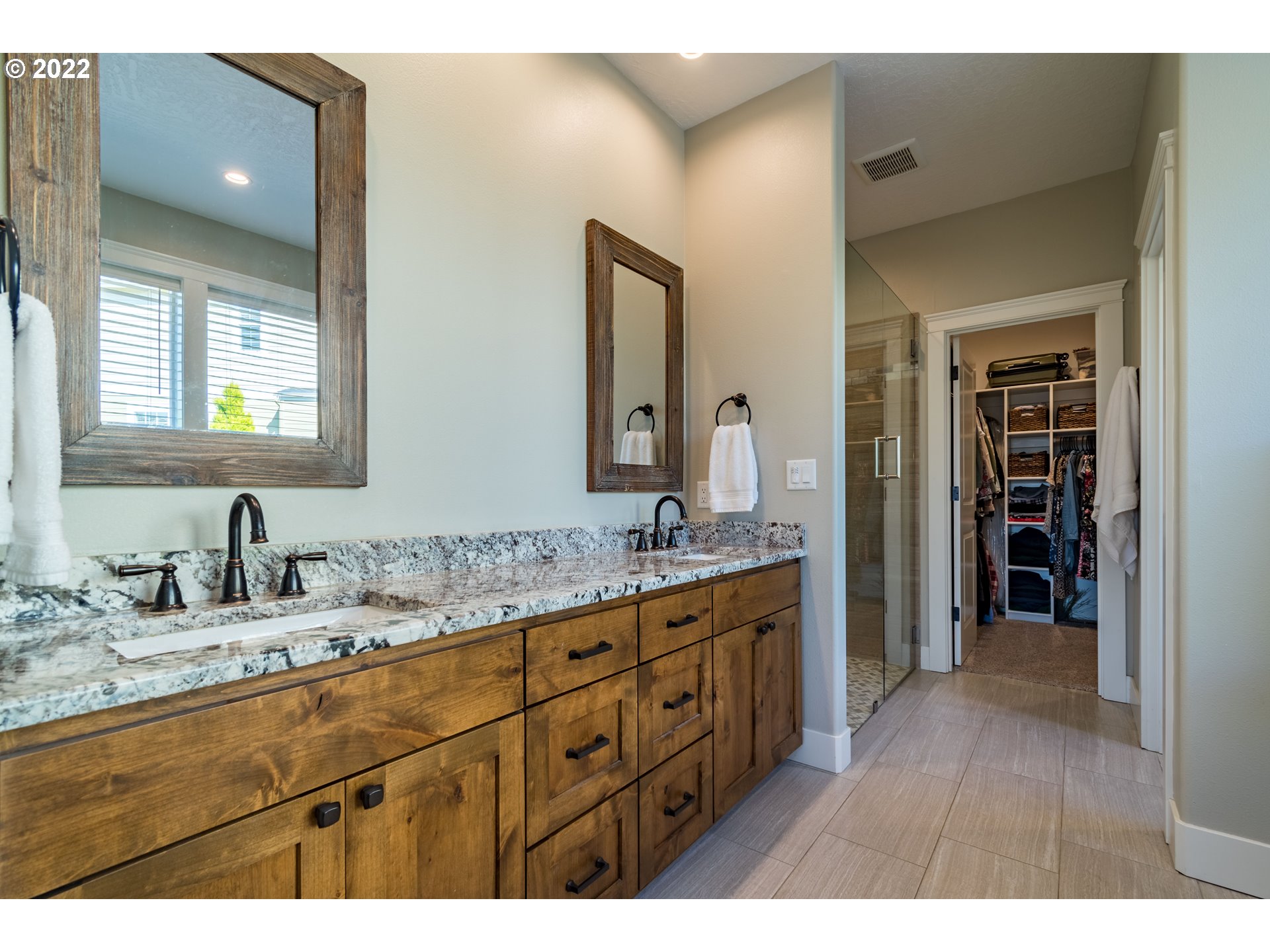 6074 Graystone Loop Springfield, OR 97478 - Photo 16 of 32 a bathroom with a granite countertop sink double and mirror