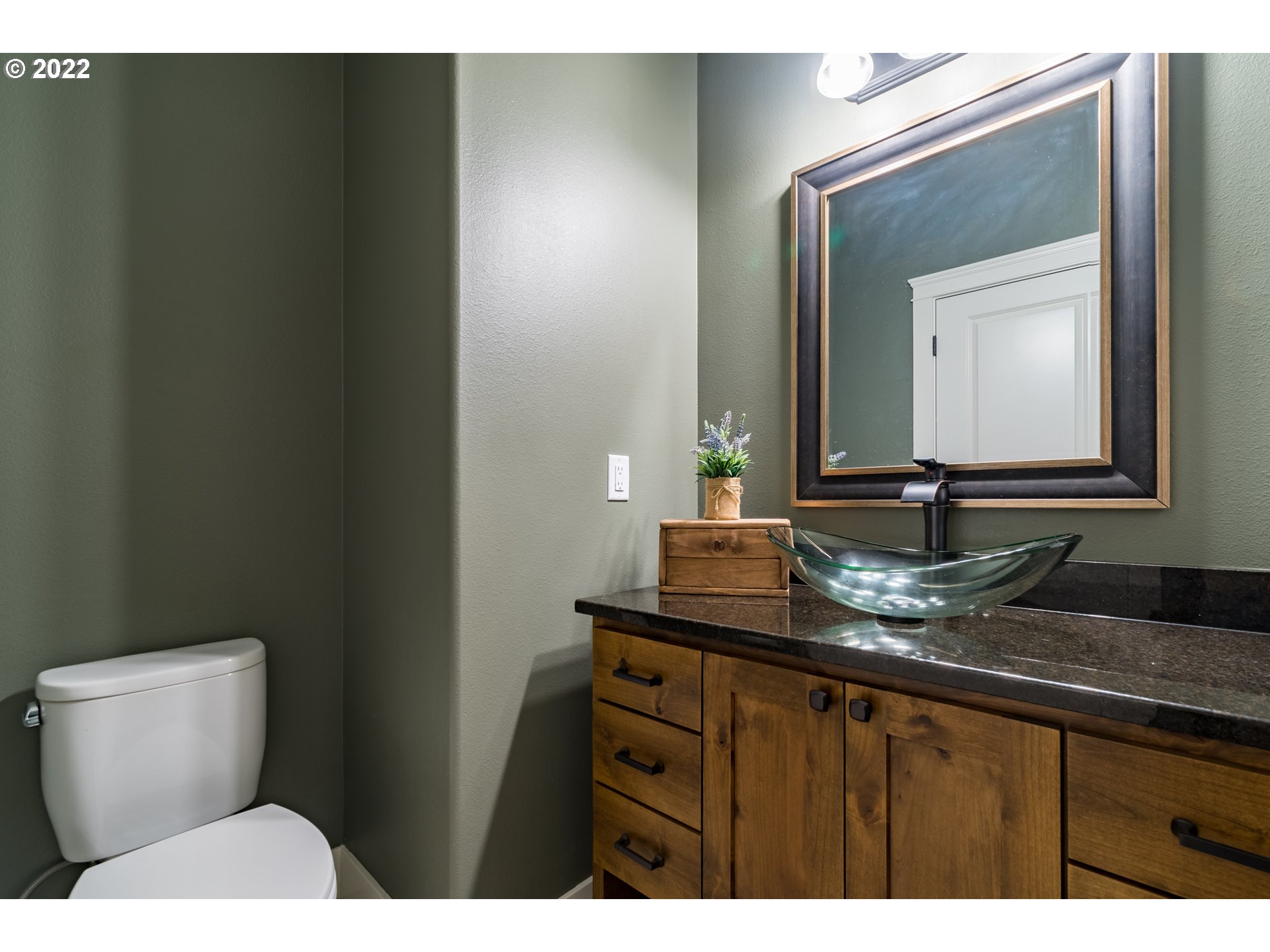 6074 Graystone Loop Springfield, OR 97478 - Photo 20 of 32 a bathroom with a granite countertop sink and a mirror