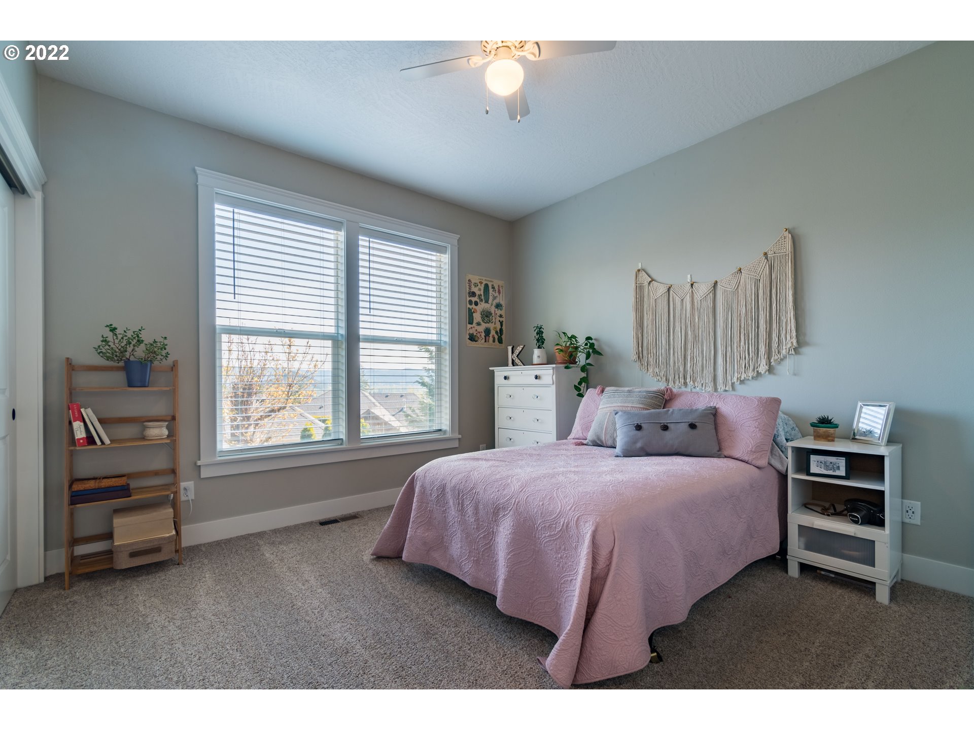 6074 Graystone Loop Springfield, OR 97478 - Photo 21 of 32 a bedroom with a bed and a window