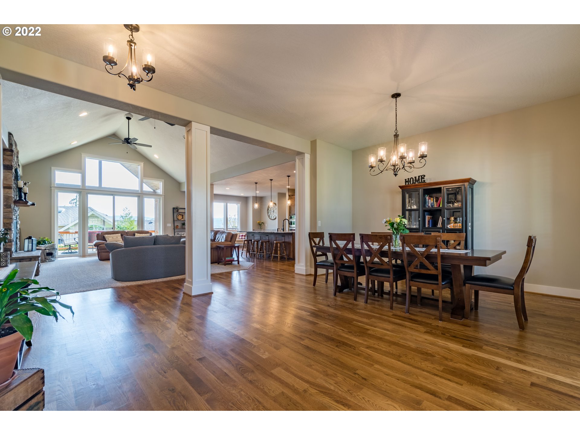6074 Graystone Loop Springfield, OR 97478 - Photo 7 of 32 a view of a dining room with furniture and wooden floor