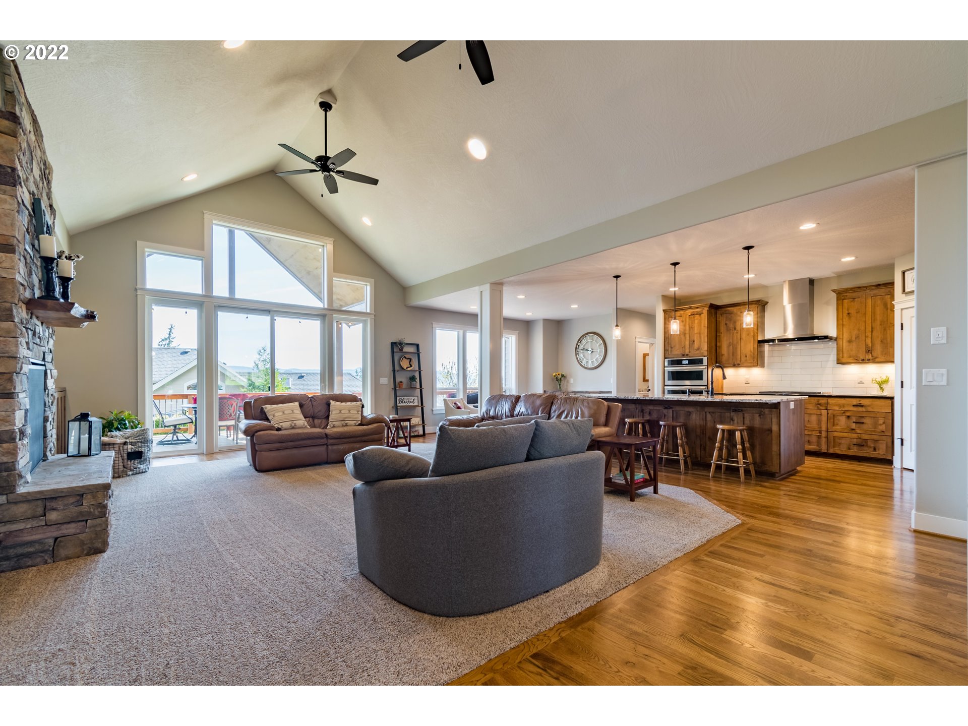 6074 Graystone Loop Springfield, OR 97478 - Photo 8 of 32 a living room with furniture and kitchen view