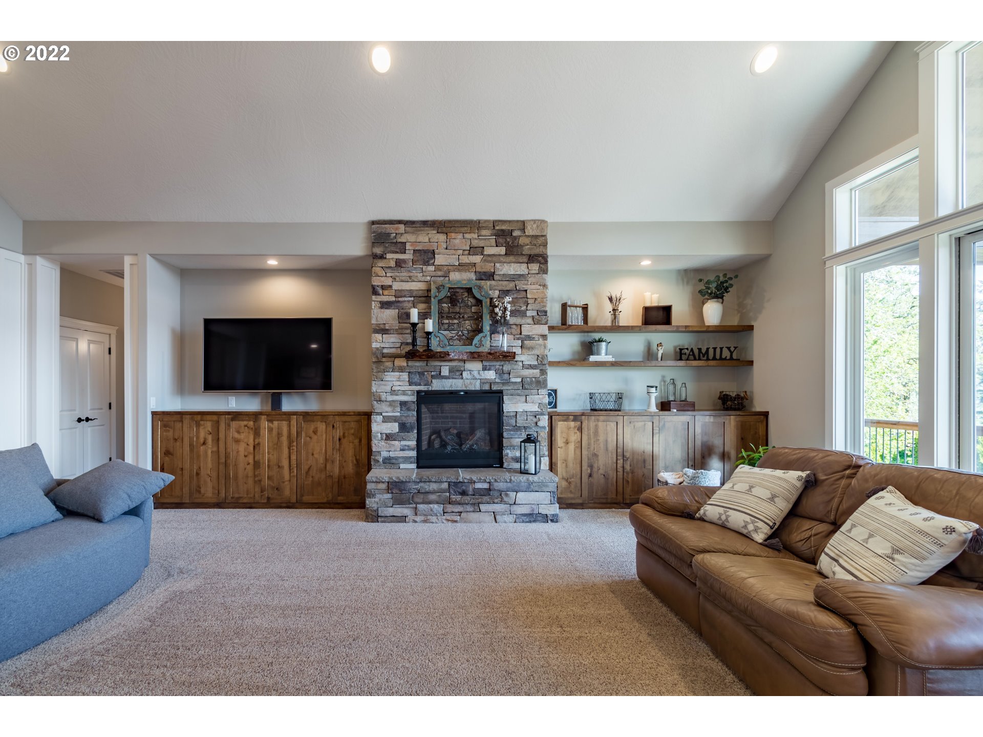 6074 Graystone Loop Springfield, OR 97478 - Photo 9 of 32 a living room with furniture and a fireplace