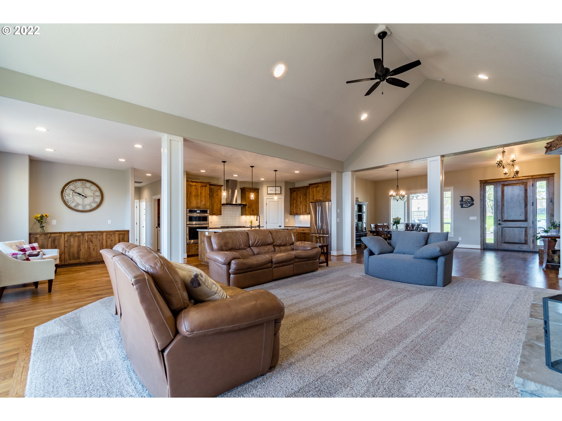 6074 Graystone Loop Springfield, OR 97478 - Photo 10 of 32 a living room with furniture and a wooden floor