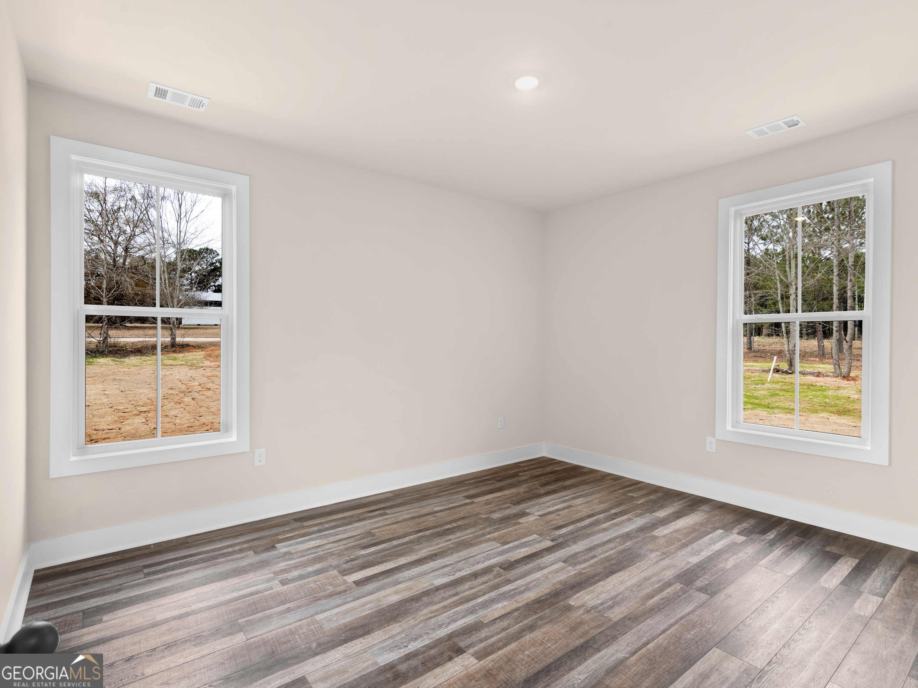 160 Loyd Road Mansfield, GA 30056 - Photo 32 of 53 a view of an empty room with wooden floor and a window