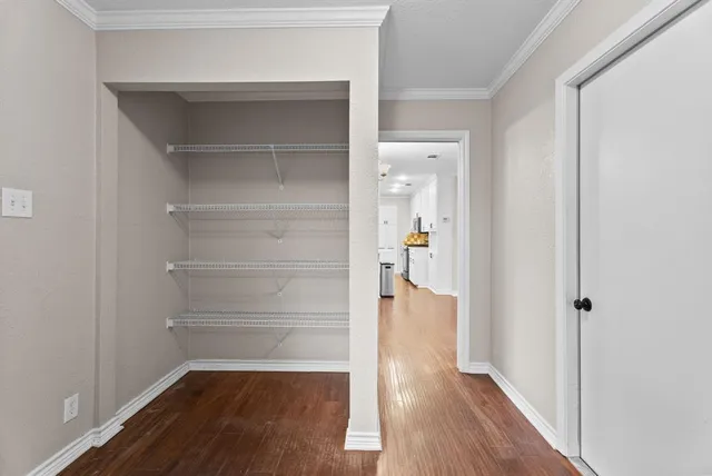 a spacious bathroom with a sink and a mirror