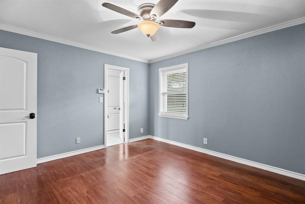 3217 Libbie Street Tyler, TX 75707 - Photo 18 of 35 a view of an empty room with window and wooden floor