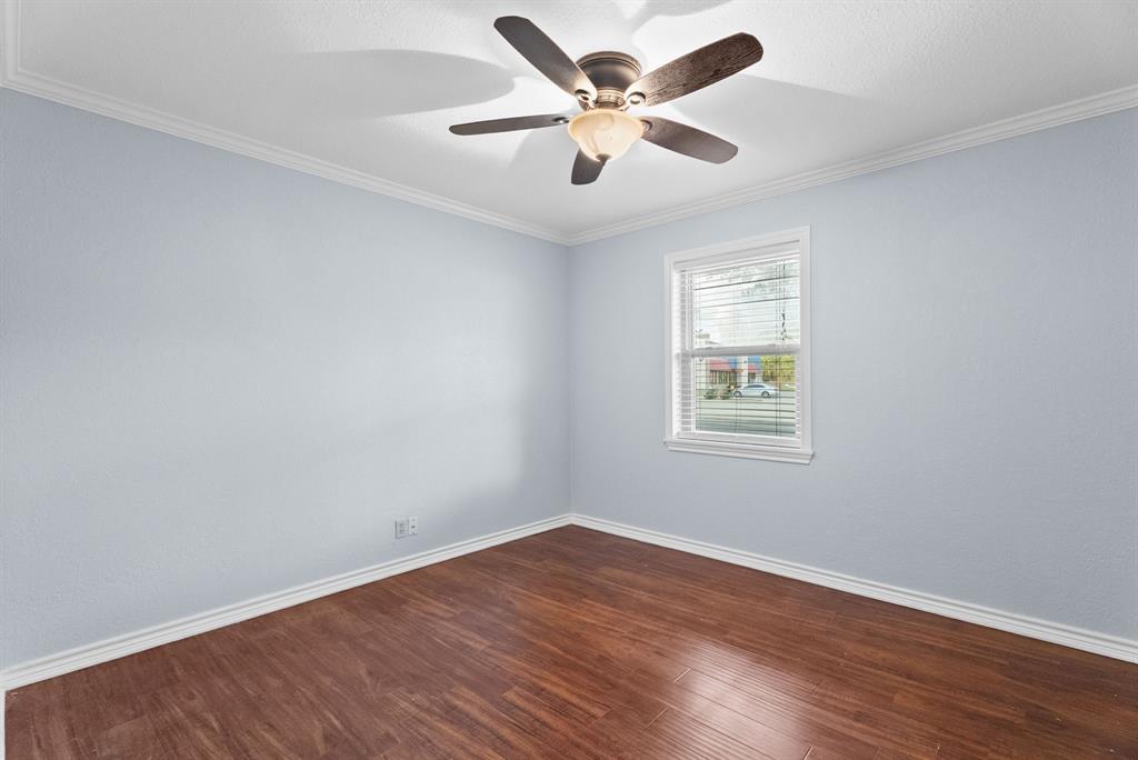 3217 Libbie Street Tyler, TX 75707 - Photo 21 of 35 wooden floor in an empty room with a window