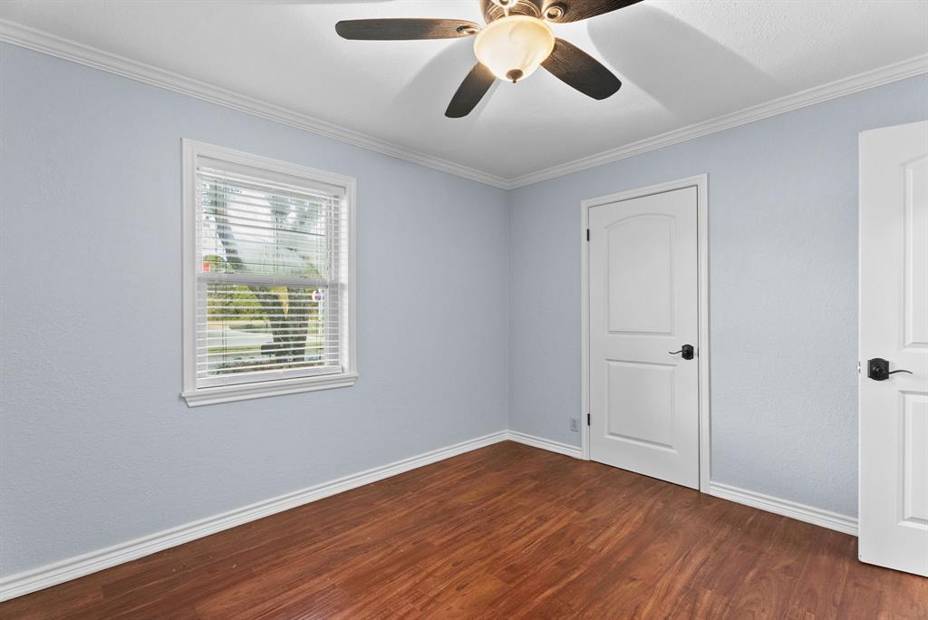 3217 Libbie Street Tyler, TX 75707 - Photo 22 of 35 a view of an empty room with wooden floor and a window