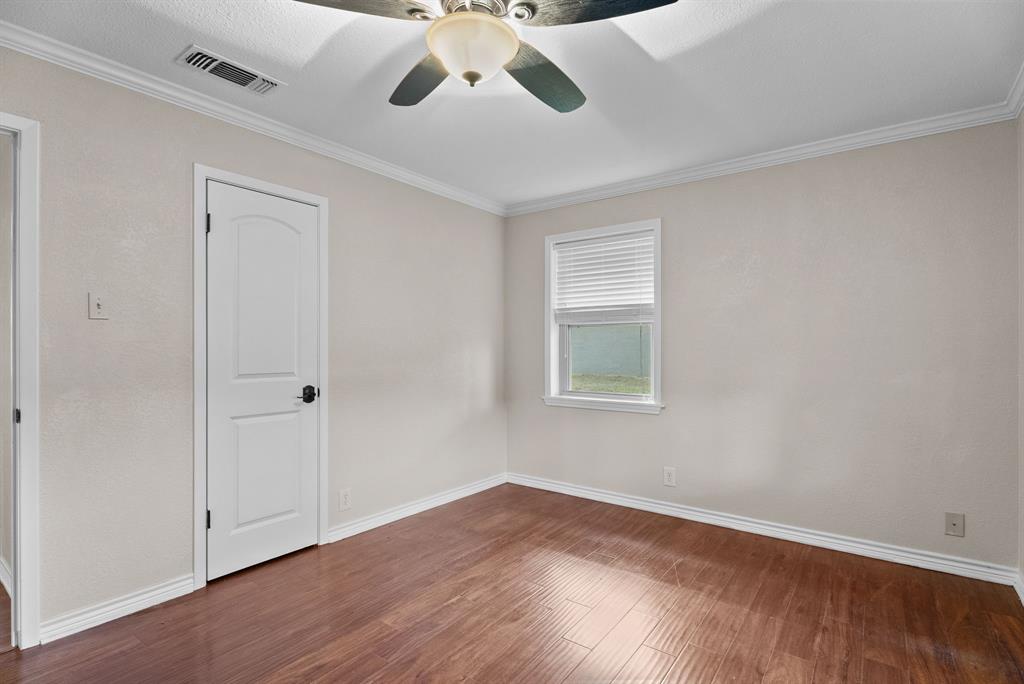 3217 Libbie Street Tyler, TX 75707 - Photo 26 of 35 a view of an empty room with wooden floor and a window