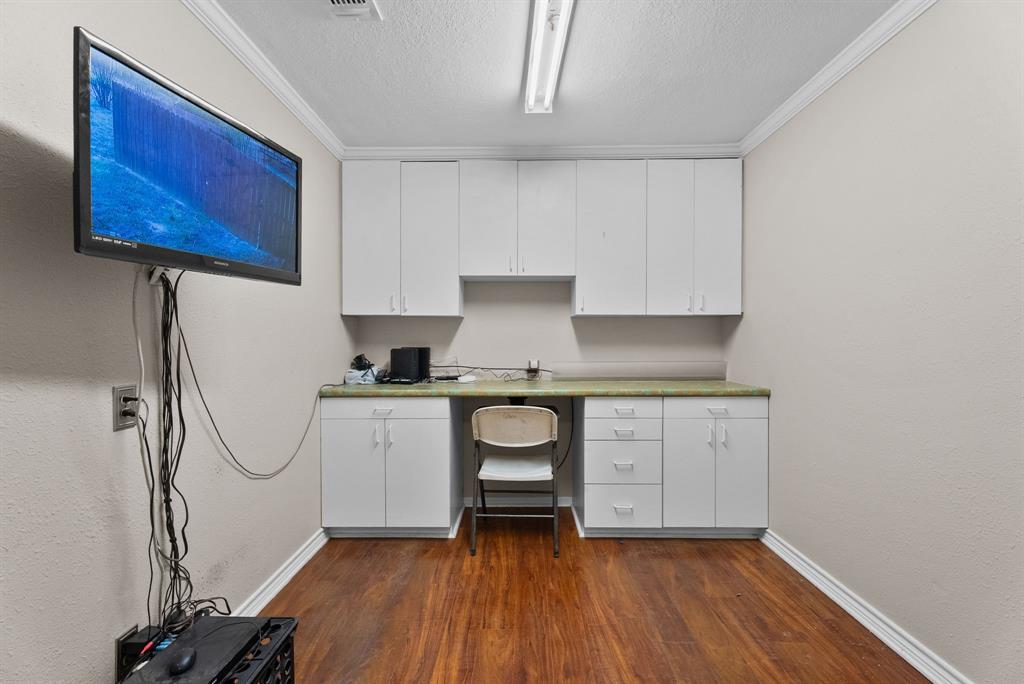 3217 Libbie Street Tyler, TX 75707 - Photo 27 of 35 a room with a white cabinets and wooden floor