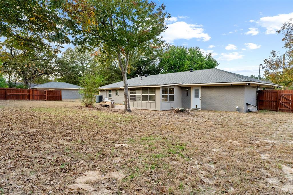 3217 Libbie Street Tyler, TX 75707 - Photo 29 of 35 front view of a house with a yard