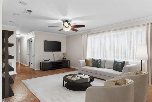 an aerial view of a residential houses with outdoor space