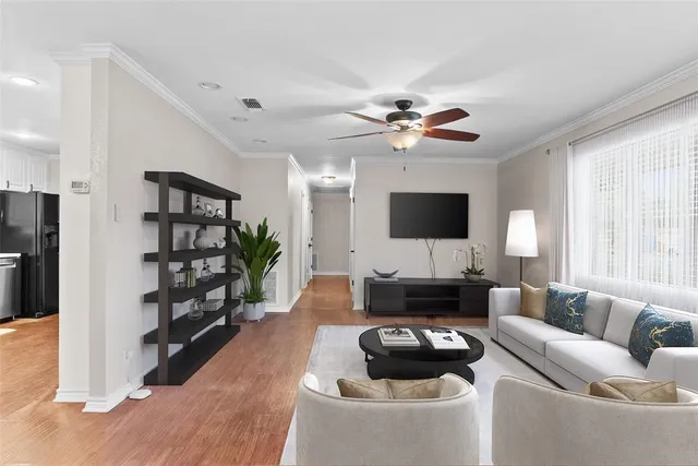 a view of livingroom with hardwood floor and ceiling fan
