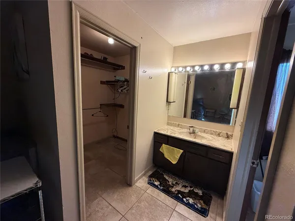 a bathroom with a sink and mirror