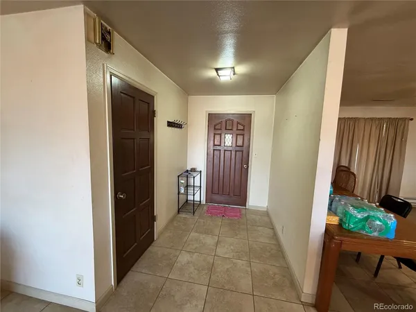 a view of hallway with furniture