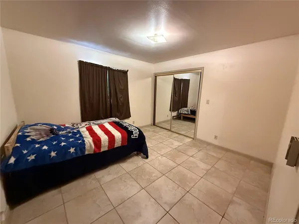 a bedroom with a bed and a cabinets