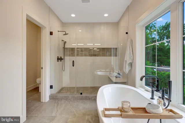 a bathroom with a tub and shower