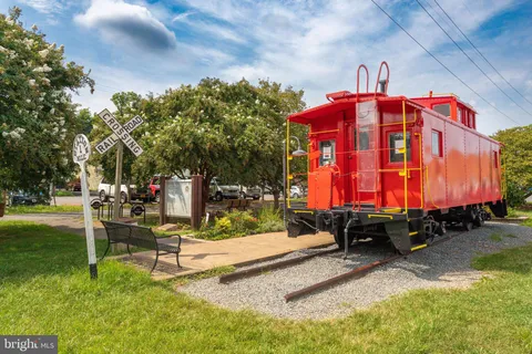 a view of swimming pool with sitting area