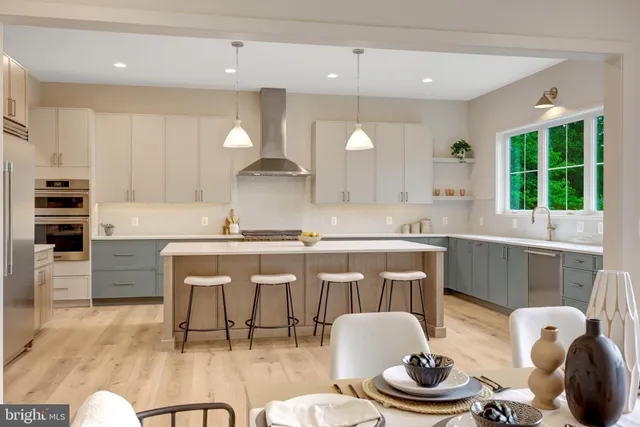 a kitchen with a table chairs stove and cabinets