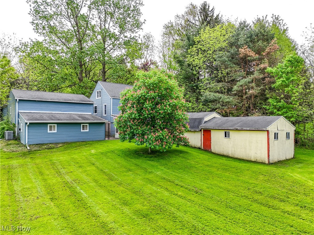 2123 Martin Road Mogadore, OH 44260 - Photo 29 of 35 View of green lawn with an outbuilding and central AC unit