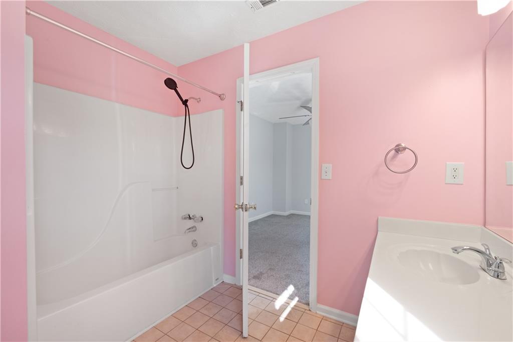 4240 Berkeley Mill Lane Duluth, GA 30096 - Photo 25 of 32 a bathroom with a bathtub shower sink and toilet