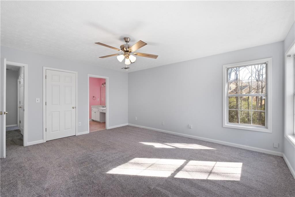 4240 Berkeley Mill Lane Duluth, GA 30096 - Photo 27 of 32 an empty room with windows and closet