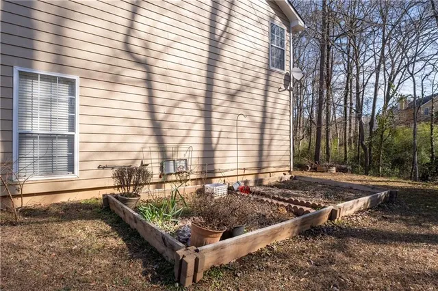 a view of a backyard with a large tree