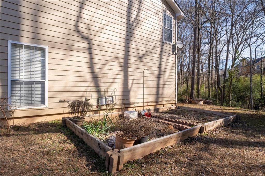 4240 Berkeley Mill Lane Duluth, GA 30096 - Photo 28 of 32 a view of a backyard with a large tree