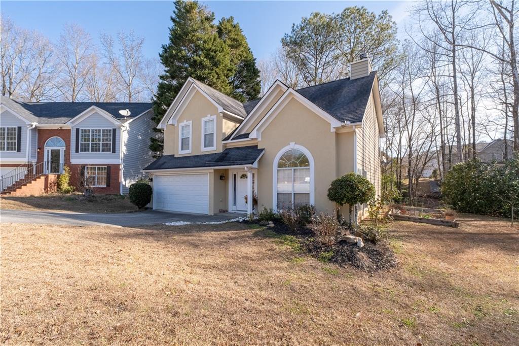 4240 Berkeley Mill Lane Duluth, GA 30096 - Photo 3 of 32 a view of house with yard and outdoor seating
