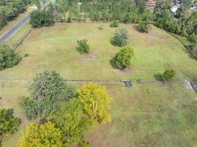 an aerial view of residential houses with swimming pool