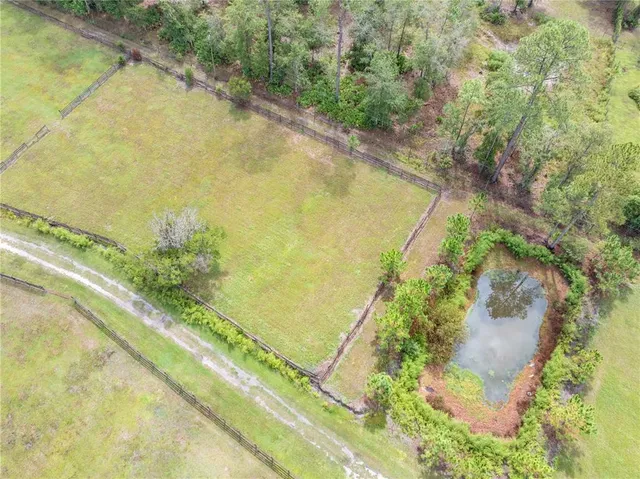 a view of a lake with a yard