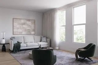 a living room with furniture and a window