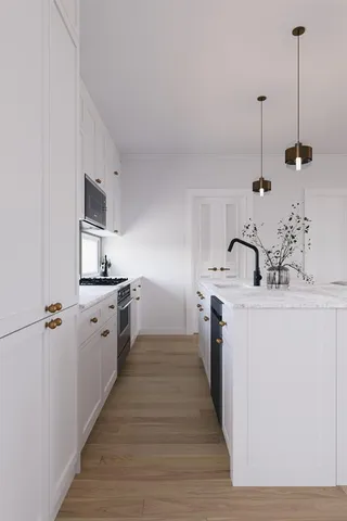 a kitchen with a sink and stove