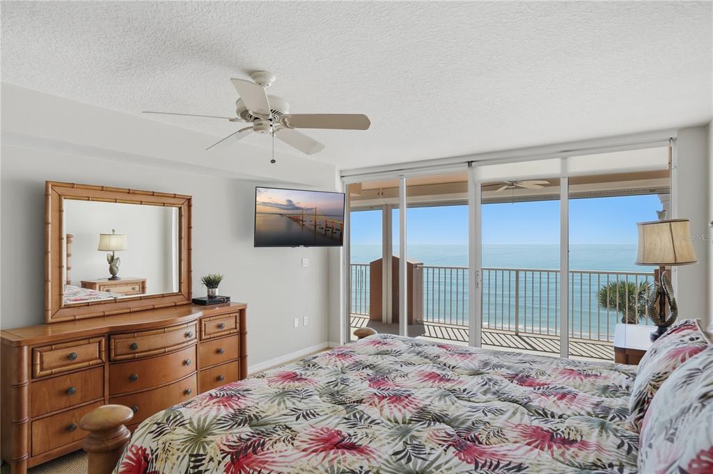16326 Gulf Boulevard, Unit 307 Redington Beach, FL 33708 - Photo 15 of 43 a bedroom with a bed and a dresser in it