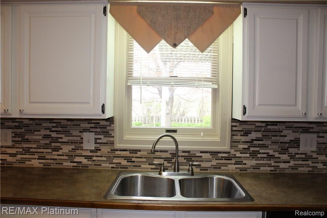 2215 Fenton Road Hartland, MI 48353 - Photo 3 of 15 Kitchen window overlooks perennial garden back yard.