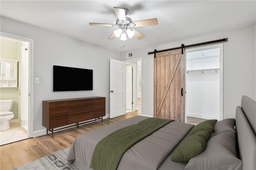 1010 Scott Boulevard, Unit A6 Decatur, GA 30030 - Photo 11 of 26 a bedroom with a bed television and a window