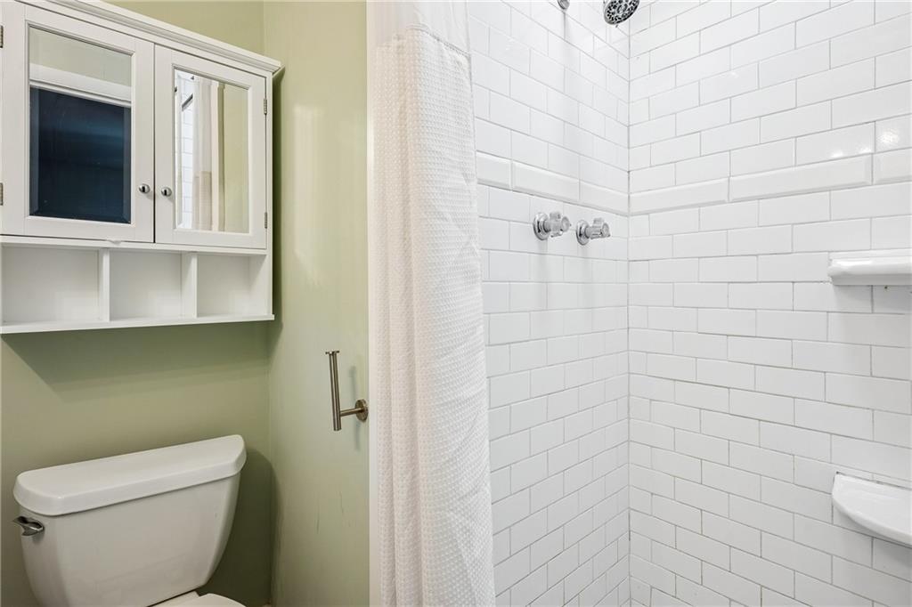 1010 Scott Boulevard, Unit A6 Decatur, GA 30030 - Photo 14 of 26 a bathroom with a toilet and a shower
